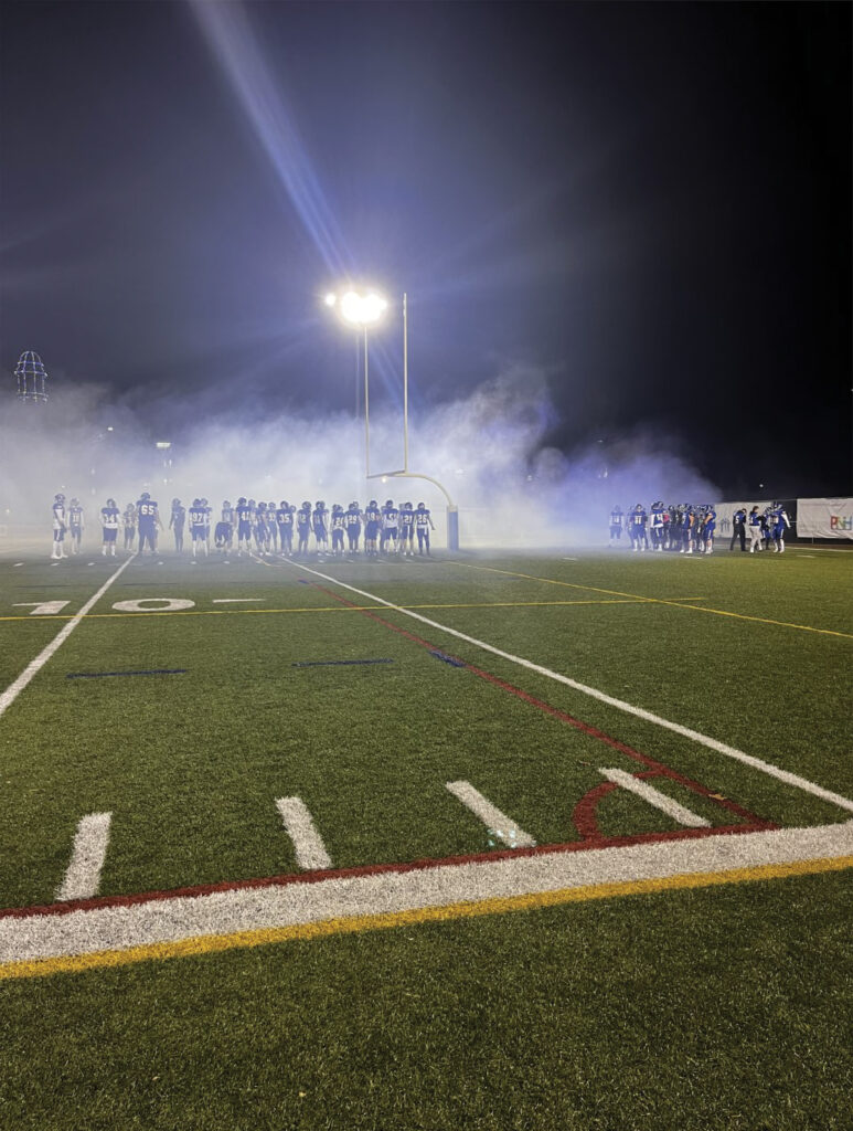 Before editing photo of football filed with smoke 